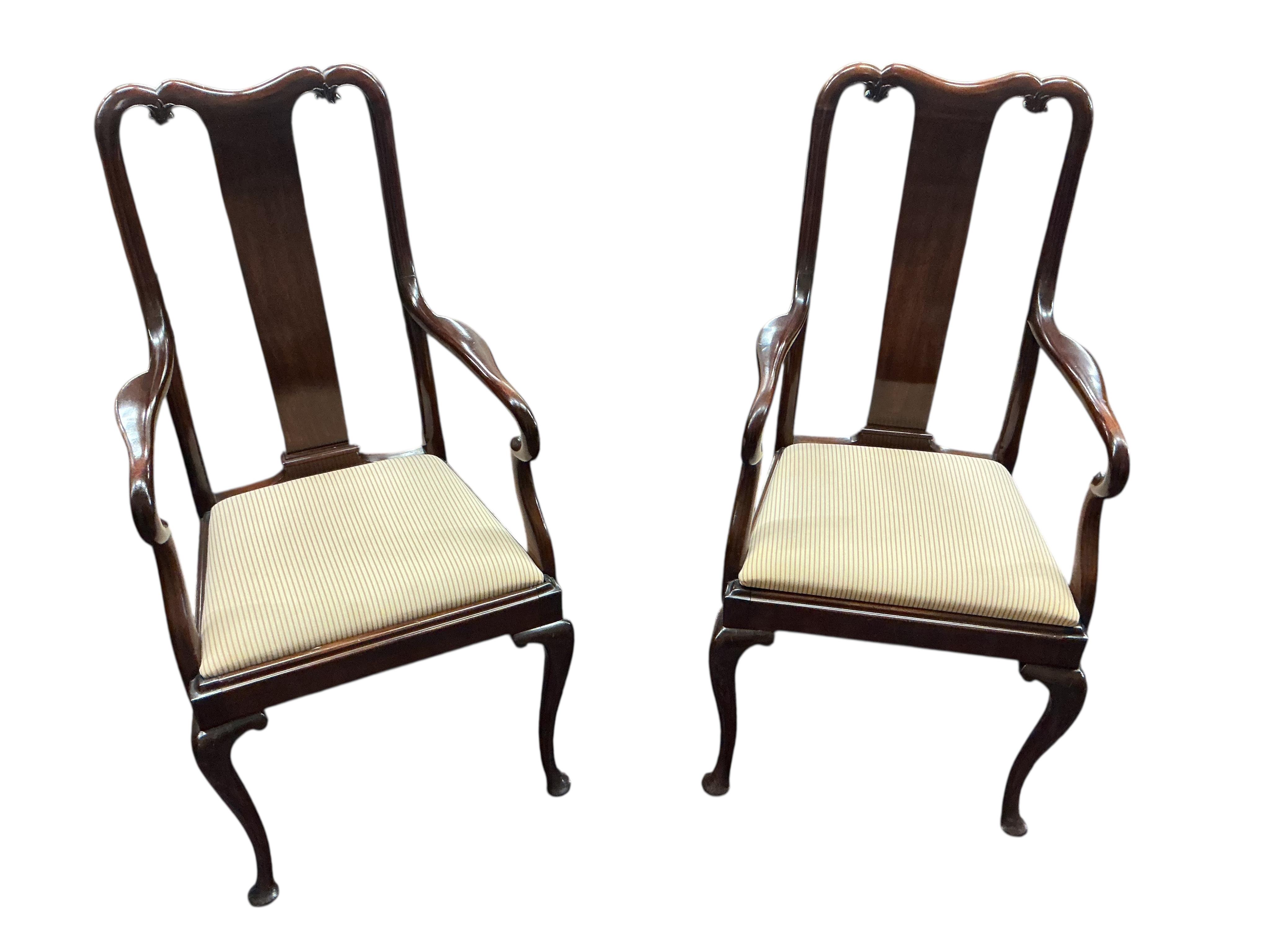 A 1920's mahogany extending dining table 206cm extended, one spare leaf, and eight Queen Anne style mahogany dining chairs, two with arms